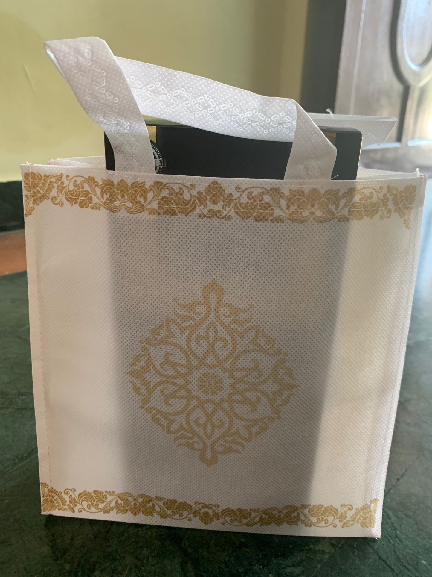 White with gold kolam design bag