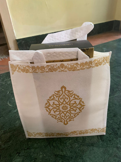 White with gold kolam design bag