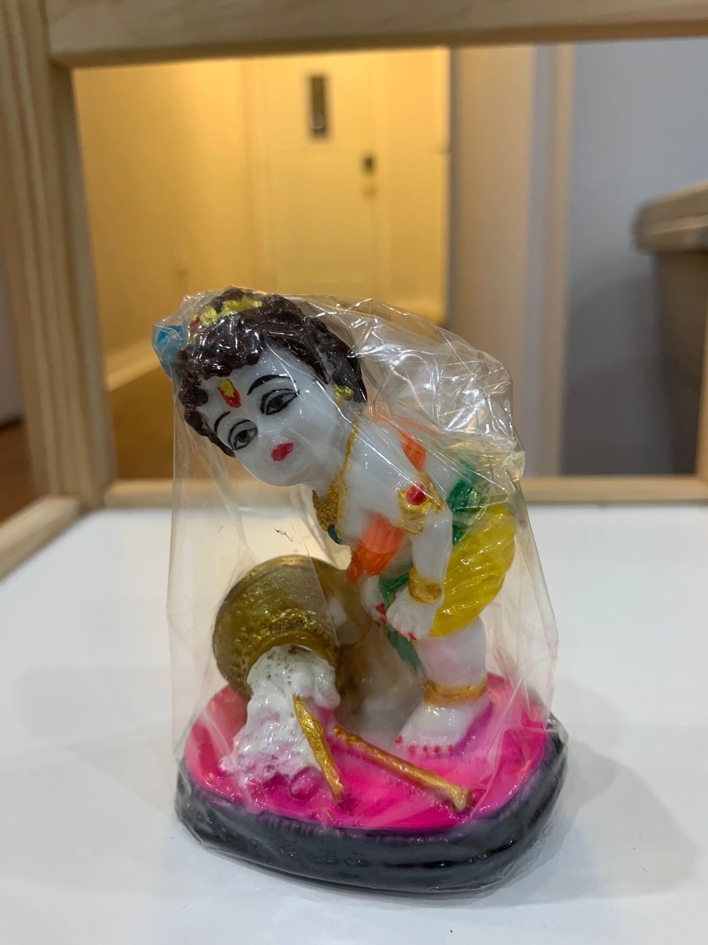 Krishna eating macan - Small